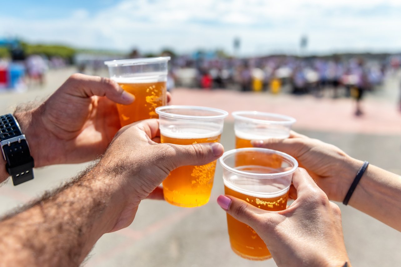 Friends drinking beer at festival